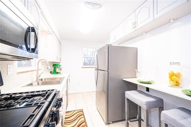 Bright and spacious kitchen with stainless steel a