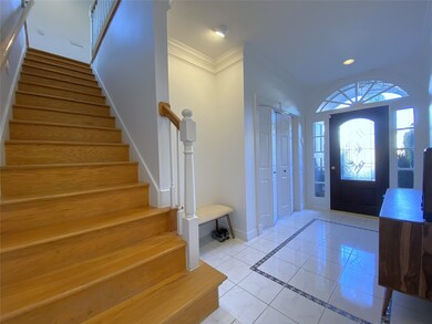 No carpet anywhere in the home! Wood stairs lead to the second story.