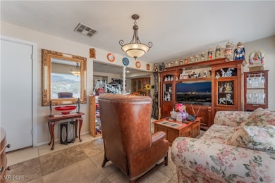 Living room featuring light tile patterned floors