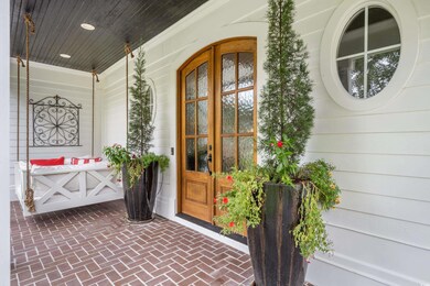View of exterior entry featuring a porch