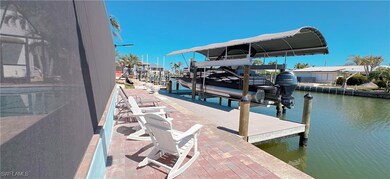 Dock area with a water view and boat lift
