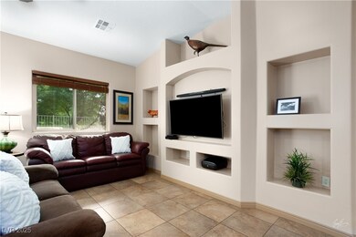 Living room with baseboards, high vaulted ceiling,