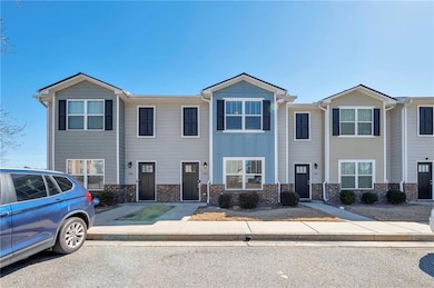 Multi unit property with brick siding and board an