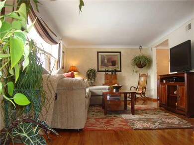 Living Room. Cove Ceilings & Refinished Red Oak Fl