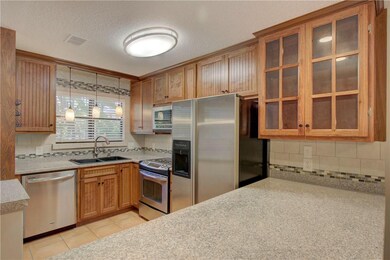 Custom wood cabinets, granite countertops, breakfa