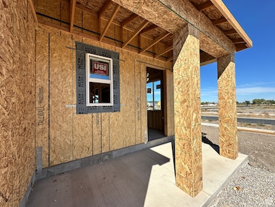 Entrance to property featuring covered porch