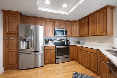 Large kitchen with stainless steel appliances.