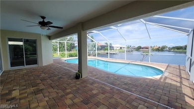 Swimming pool featuring a patio area, a water view