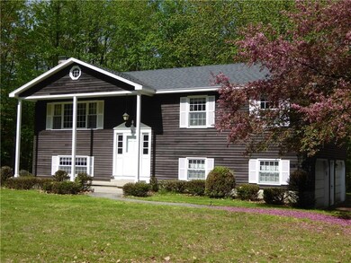 with cedar clapboard siding and a 2...