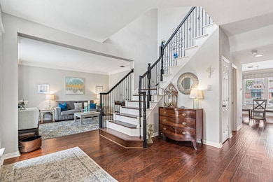 Welcoming entryway with rich wood floors
