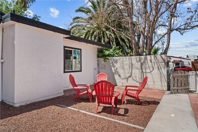 View of yard featuring a gate and fence