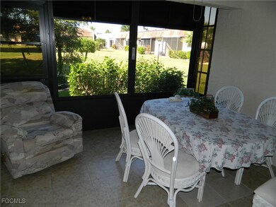 Sunroom featuring outdoor dining area