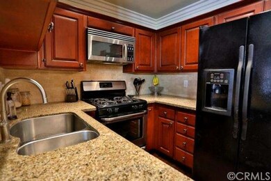 Beautiful granite counters and re-faced cabinets. 