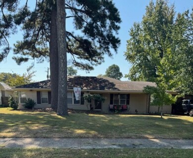 Single story home with a front yard