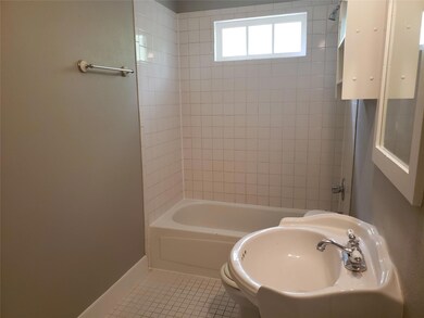 Bathroom featuring tile patterned flooring, tiled 