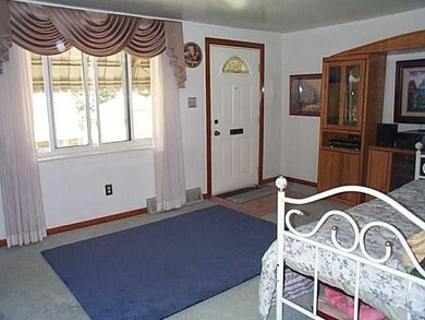 Living Room. Large window in the living room provides natural lighting into the living space.