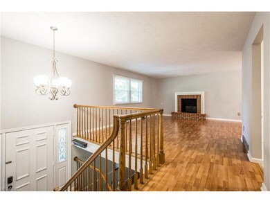 Another view of the living room showing the firepl