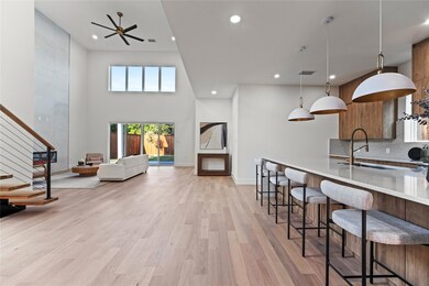 Kitchen with decorative backsplash, a kitchen bar,