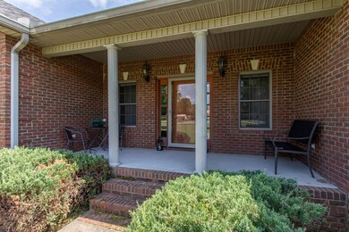 A covered front porch welcomes quests and family.