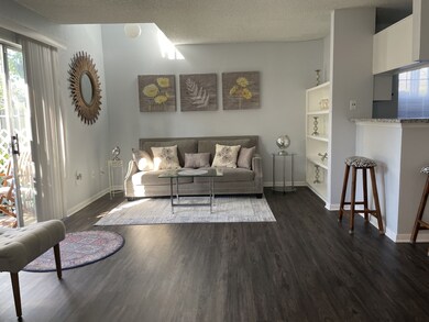 Spacious living room with high end vinyl plank floors and fresh paint