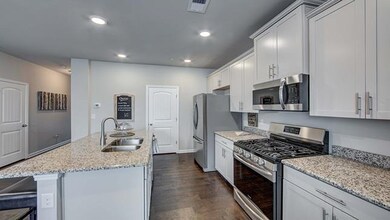 Lots of cabinets and island seating.  Granite and SS appliances.  All photos of another home.  Finishes will vary.
