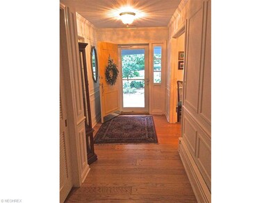 The front hallway offers handsome moldings and har