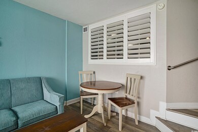 Dining area featuring wood finished floors and baseboards