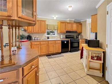 Kitchen features additional cabinets for storage a