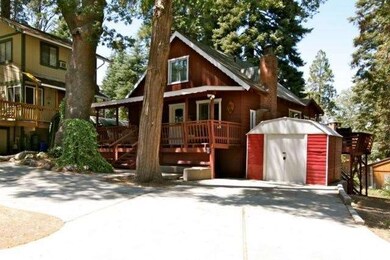 Ample parking on level concrete driveway with stor