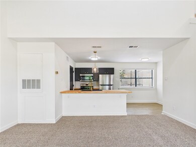 Kitchen featuring stainless steel appliances, ligh