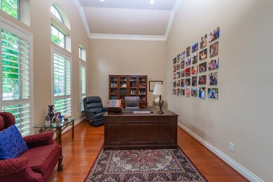 The study offers the perfect spot for tackling your work projects with refreshing views of the beautifully landscaped front yard.