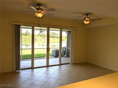 Doorway featuring light tile patterned flooring, c