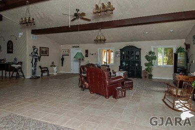Welcoming front room with open concept layout prov