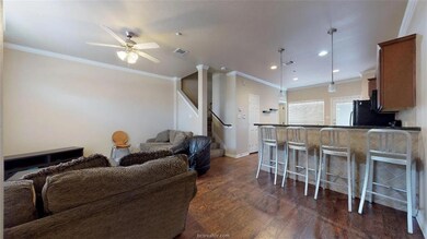 Kitchen with visible vents, crown molding, a break