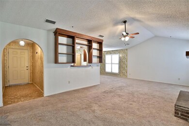 LOVELY FOYER OPENS TO VAULTED LIVING AREA