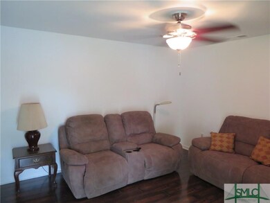 Living room shown with furnishings