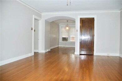 Arched opening to the dining area adds to the eleg