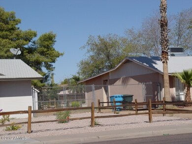 Frontyard landscaping w/split rail fence