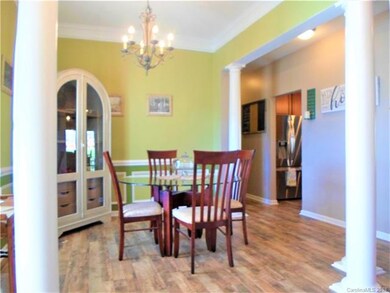 Columns, wainscoting and crown molding make this a