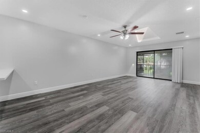 Spare room featuring ceiling fan, wood finished floors, a skylight, and recessed lighting
