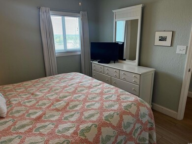 Bedroom featuring wood-type flooring