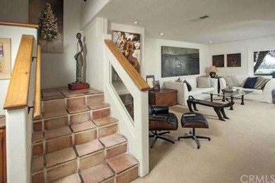 Rustic Spanish pavers in entrance foyer continue d