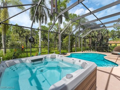 View of hot tub and pool