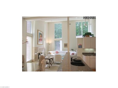 The bright and open great room features vaulted ce