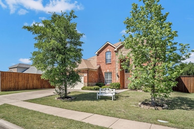 Traditional-style house with a front lawn, concret