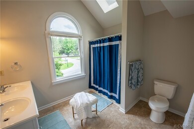 Cute, roomy master bath with dual sink and mirrors