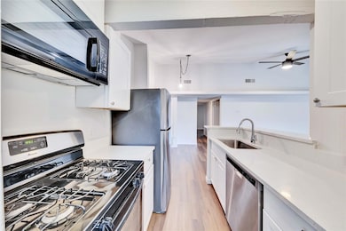 Kitchen featuring appliances with stainless steel