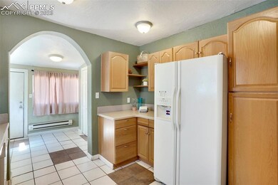 Kitchen and rear entry door to rear yard.