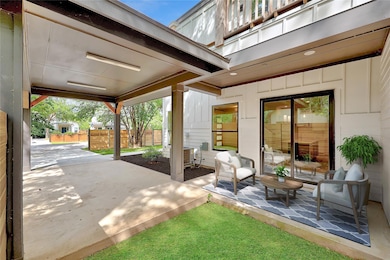 View of patio with fence