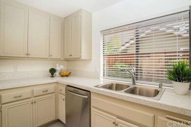 Kitchen is light and bright with the window overlo